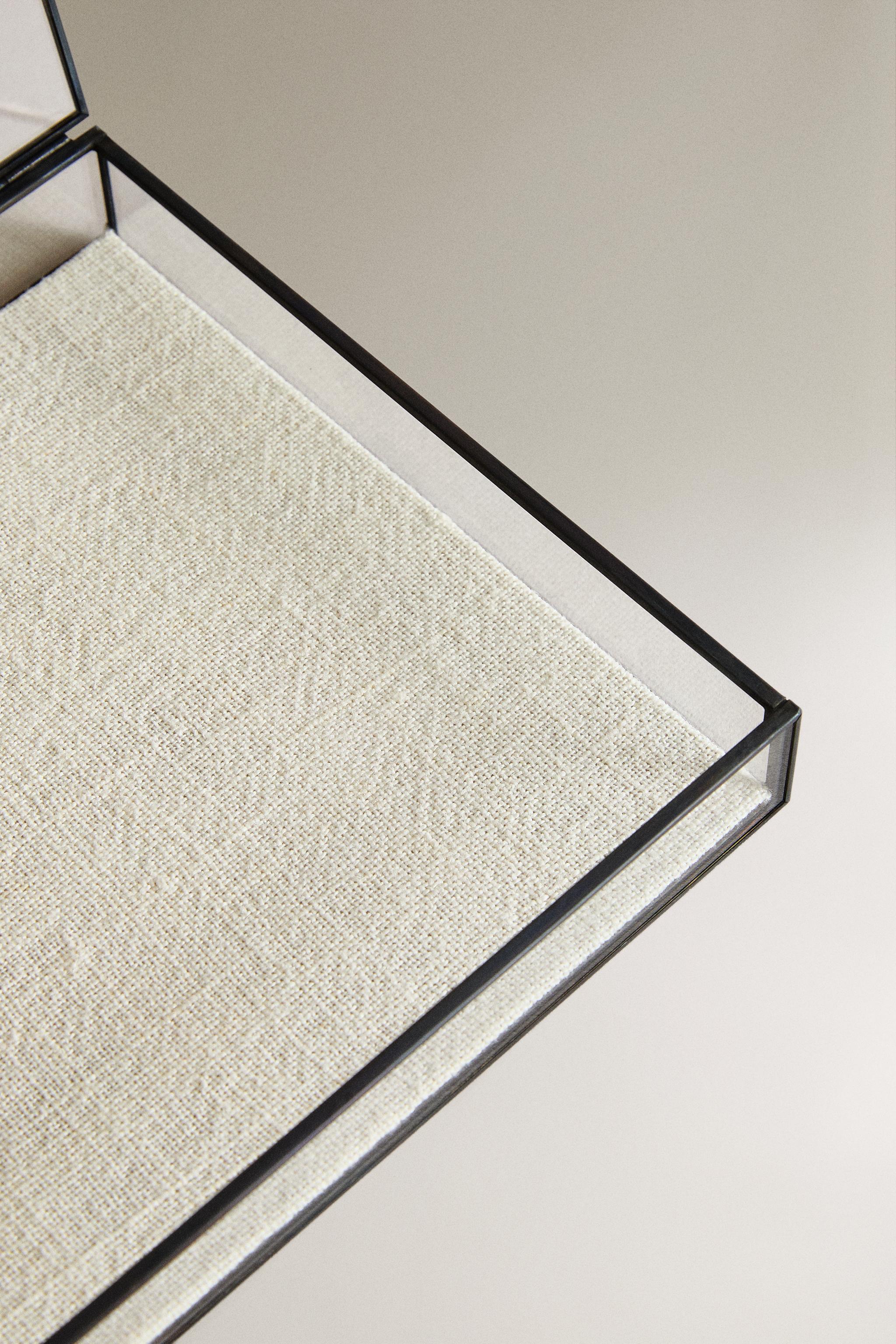 JEWELRY BOX WITH A BLACK METAL BORDER